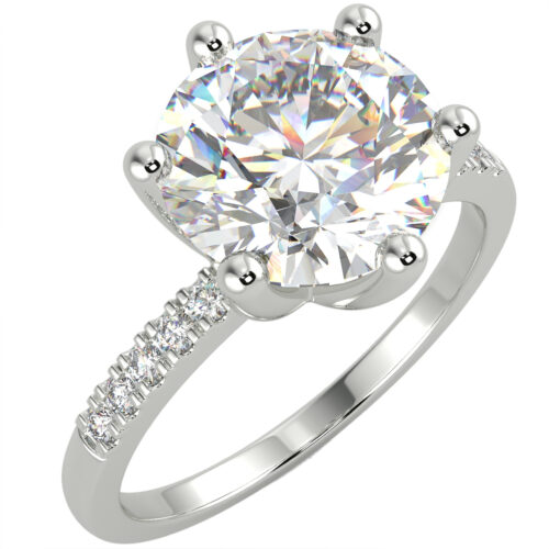 White gold round cut diamond engagement ring in a side stone setting