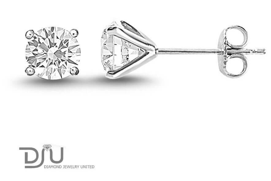 A pair of diamond stud earrings in martini setting with push-backs.