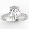 White gold oval diamond engagement ring in a pave setting